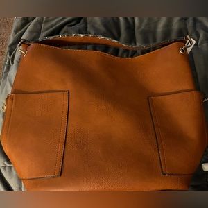 Purse within a purse. Large tote w/ crossbody purse so that 2 for the price of 1